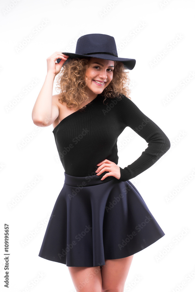 Portrait of elegant woman in black hat and dress. Studio shot Portrait of elegant woman in black hat and dress. Studio shot