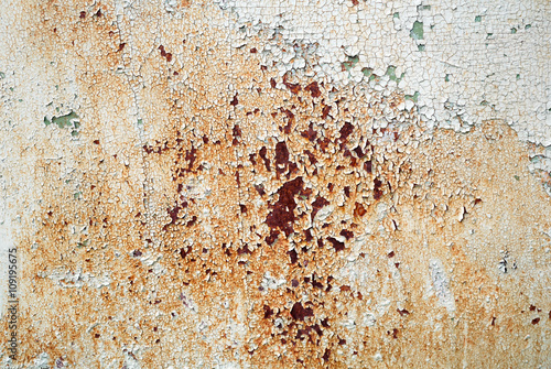 Abstract grunge background. Old weathered texture. Peeling paint texture with cracks and rust spots. 