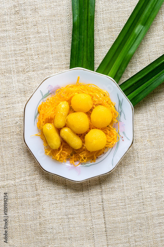 Thai Dessert - Sweet egg floss and egg yoke fudge balls cooked i photo