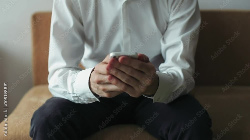 Man and Corresponds with Someone by Phone. The man has decided to have a rest at Friday evening and brings together the company. Man and Corresponds with Someone by Phone. The man has decided to have a rest at Friday evening and brings together the company.