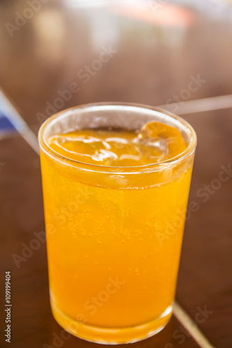Wallpaper Mural Orange juice with ice in a glass place on the table Torontodigital.ca
