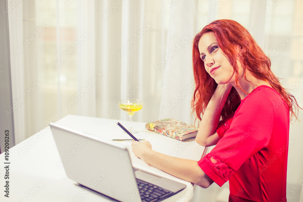 Beautiful woman using
laptop, phone at table in cafe. Beautiful woman using
laptop, phone at table in cafe.