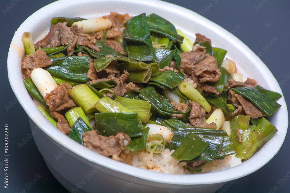 White rice with green vegetables and meat