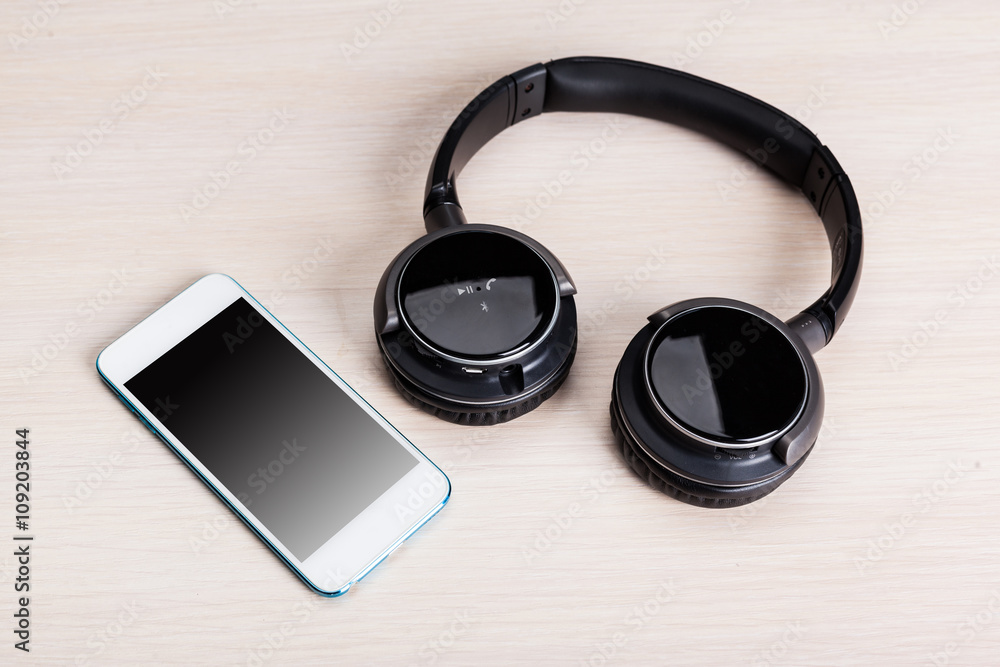 headphones on wooden background headphones on wooden background