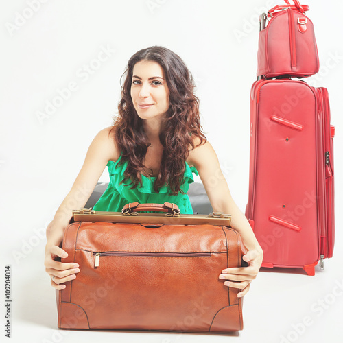 Woman holding hand luggage, weight and baggage dimensions photo