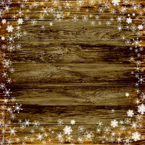 winter background, snowflakes on a wooden background
