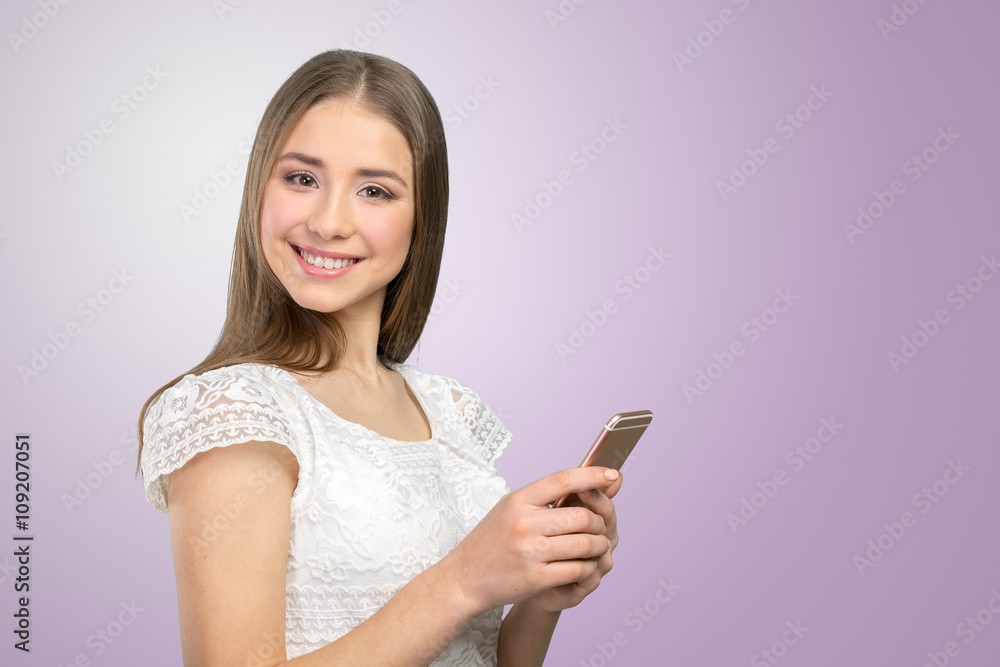Beautiful  woman texting on her cell phone