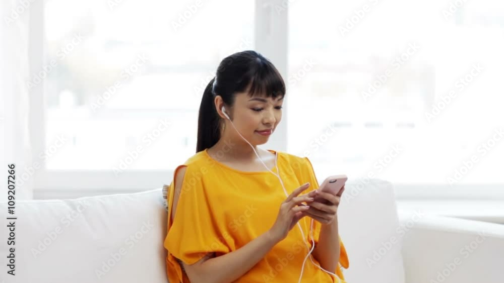 happy asian woman with smartphone and earphones happy asian woman with smartphone and earphones