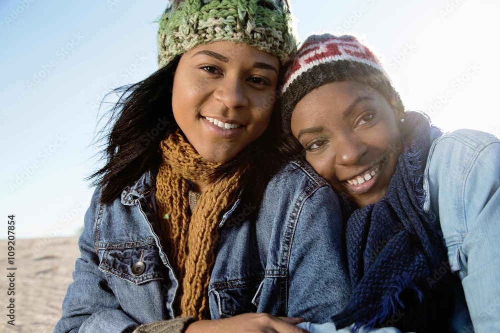 Portrait of two friends, outdoors, smiling Portrait of two friends, outdoors, smiling