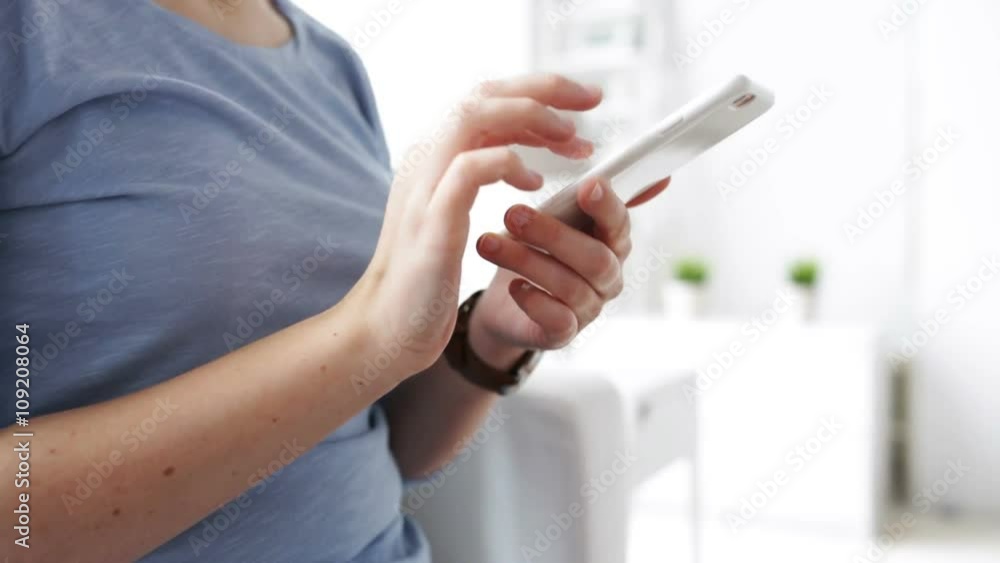 woman hands texting message on smartphone at home woman hands texting message on smartphone at home