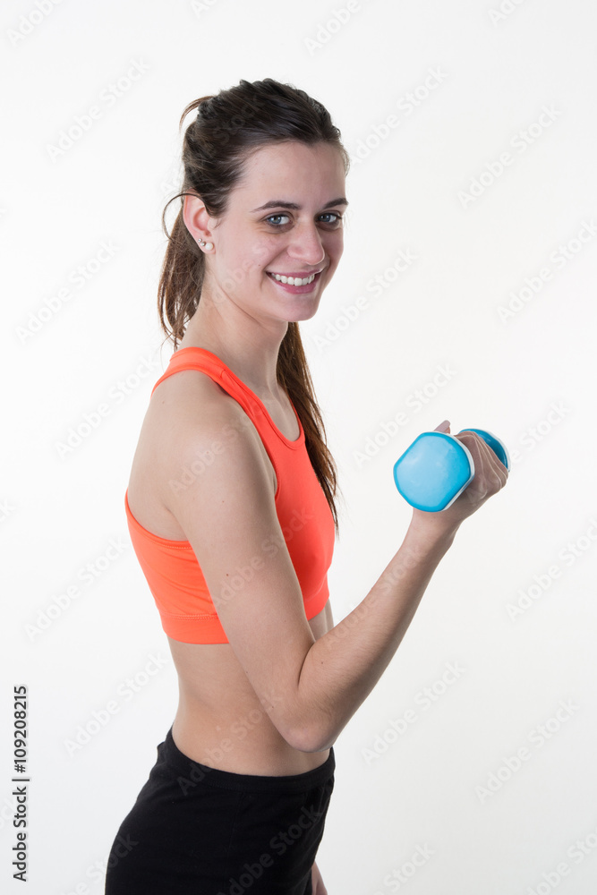 Fit fitness girl smiling happy lifting weights, training shoulder muscles. Fit fitness girl smiling happy lifting weights, training shoulder muscles.