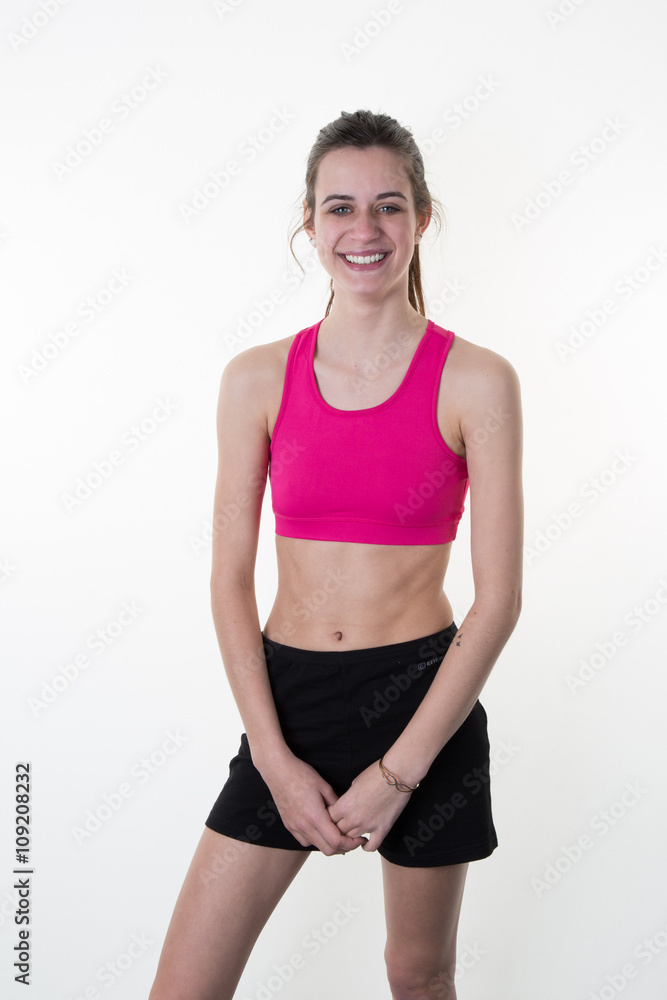 young woman in pink sports wear isolated on white background