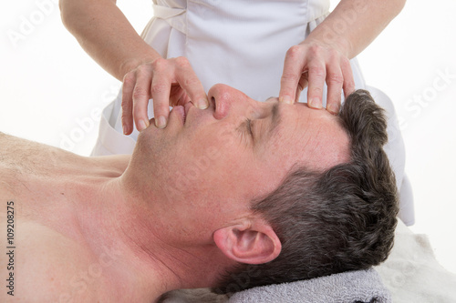 Facial and cranial osteopathy therapy in a medical room
