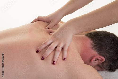 Close-up of a man's back having a massage in a spa center