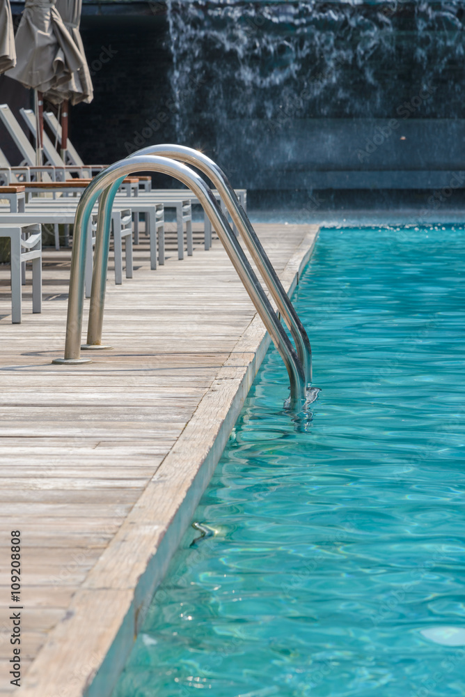 Metal staircase to the entrance to the swimming pool. vertical view