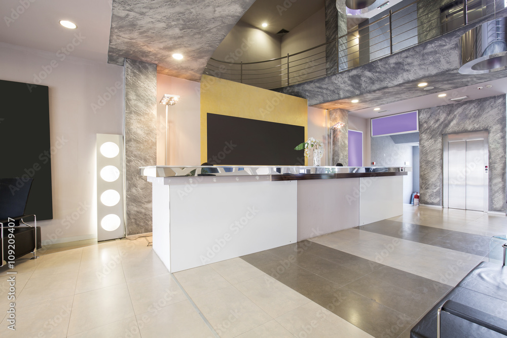 Modern building lobby with reception desk Modern building lobby with reception desk