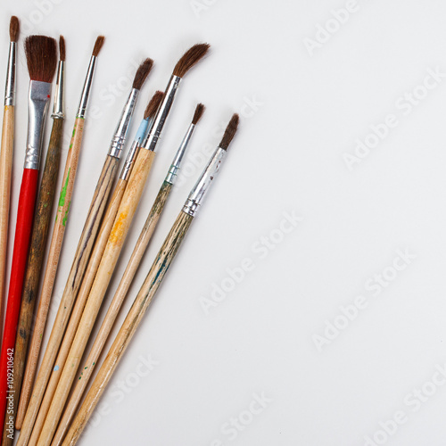  brushes for painting and blank white paper sheet 