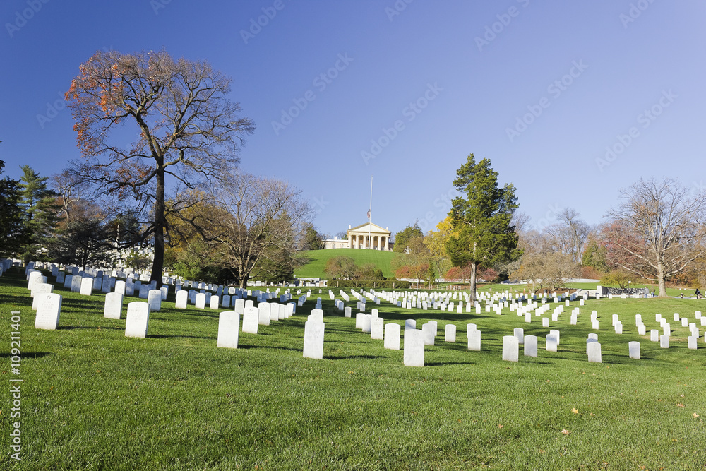 Simple marble headstones in Section 31 at Arlington National Cemetery with Arlington House at the top of the hill in the distance, Virginia Simple marble headstones in Section 31 at Arlington National Cemetery with Arlington House at the top of the hill in the distance, Virginia