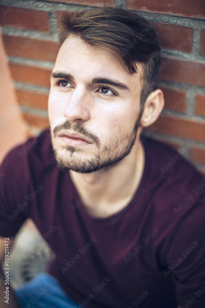Handsome caucasian young man in casual clothes in urban environm Handsome caucasian young man in casual clothes in urban environm