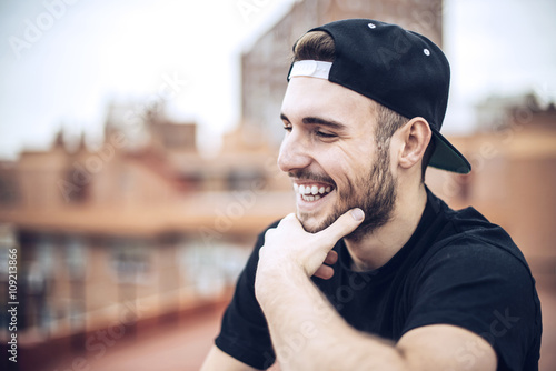 Handsome caucasian young man in casual clothes in urban environm