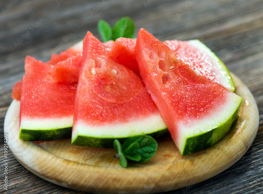 Slices of watermelon on wooden background Slices of watermelon on wooden background