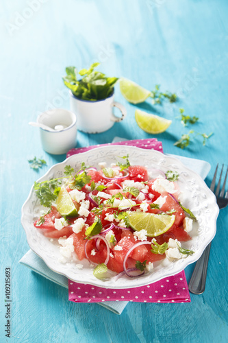 Watermelon salad with feta cheese and onion