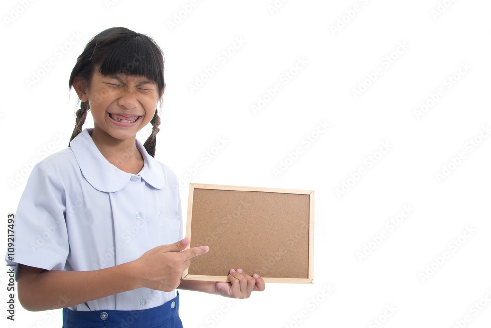 Funny girl showing her broken teeth and holding corkboard on whi Funny girl showing her broken teeth and holding corkboard on whi