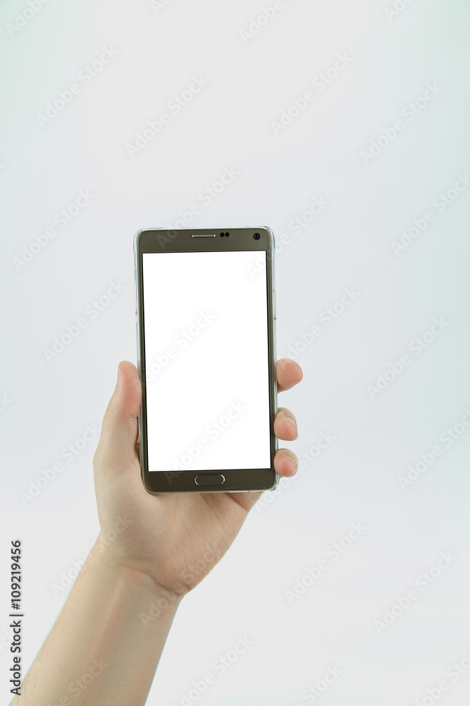 Big smartphone with empty blank display in hand isolated on the white background