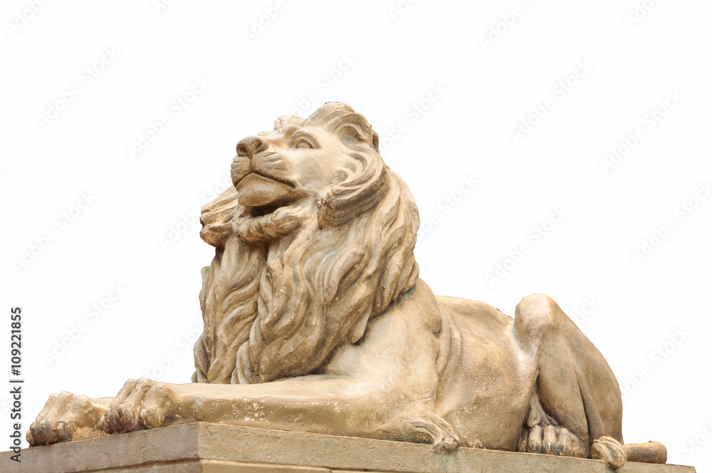 lion statue sits majesticaly on pedestal.