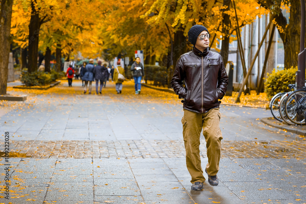 Fototapeta premium An Asian Man in a Brown Jacket