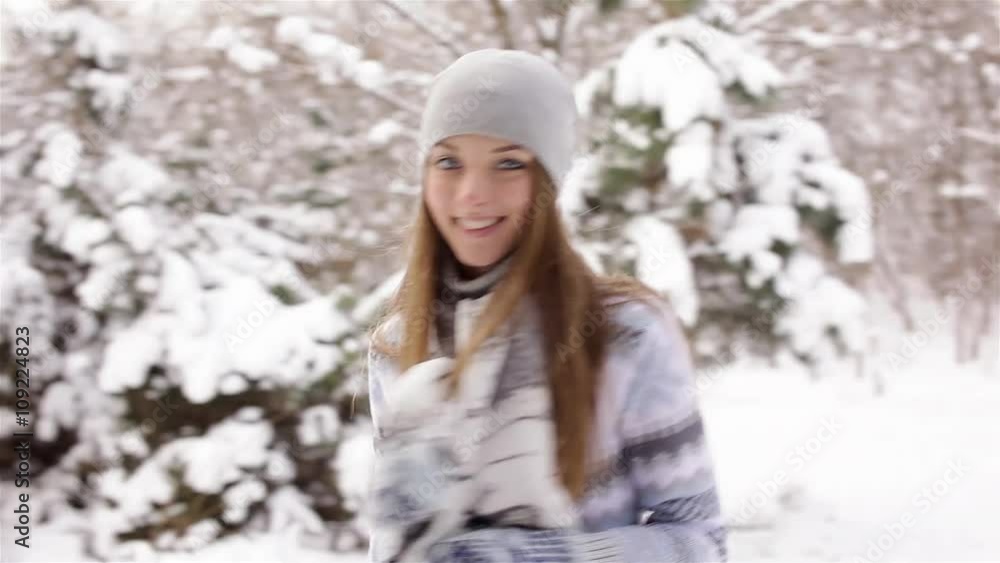 Beautiful girl in winter forest flirts with camera Beautiful girl in winter forest flirts with camera