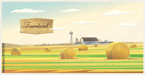 Autumn landscape with hay, and farm on the back plan.