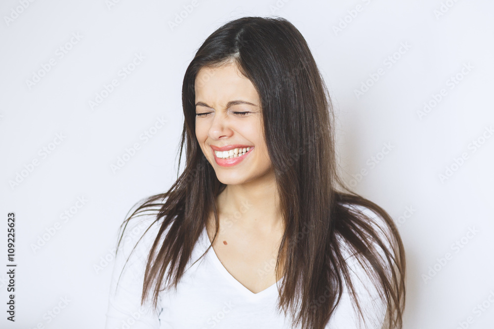 Beautiful woman smiling. Young Female touching Her Skin. Portrait on White Background. Perfect Skin. Beauty Face. Beautiful woman smiling. Young Female touching Her Skin. Portrait on White Background. Perfect Skin. Beauty Face.