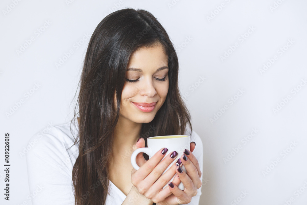 young pretty woman drinking coffee or tea . Relaxing girl . Woman drinking coffee in the morning at home lifestyle. young pretty woman drinking coffee or tea . Relaxing girl . Woman drinking coffee in the morning at home lifestyle.