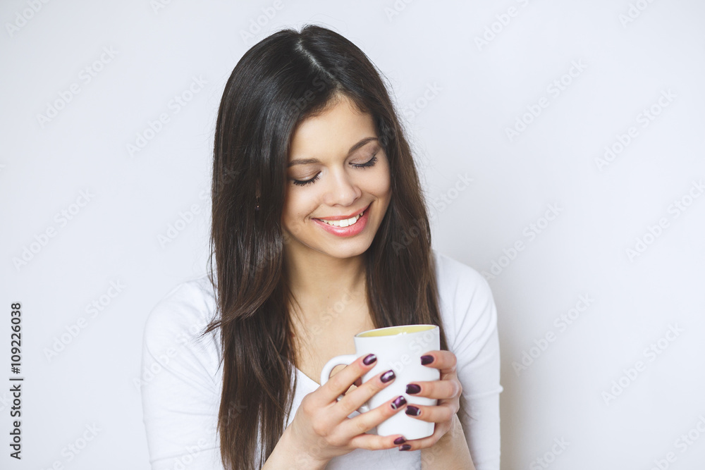 young pretty woman drinking coffee or tea . Relaxing girl . Woman drinking coffee in the morning at home lifestyle. young pretty woman drinking coffee or tea . Relaxing girl . Woman drinking coffee in the morning at home lifestyle.