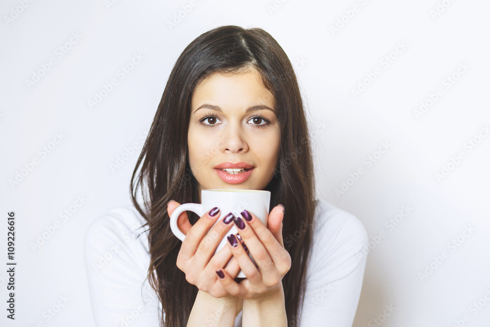 young pretty woman drinking coffee or tea . Relaxing girl . Woman drinking coffee in the morning at home lifestyle. young pretty woman drinking coffee or tea . Relaxing girl . Woman drinking coffee in the morning at home lifestyle.