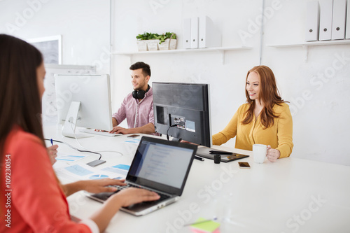 creative team with computers working at office