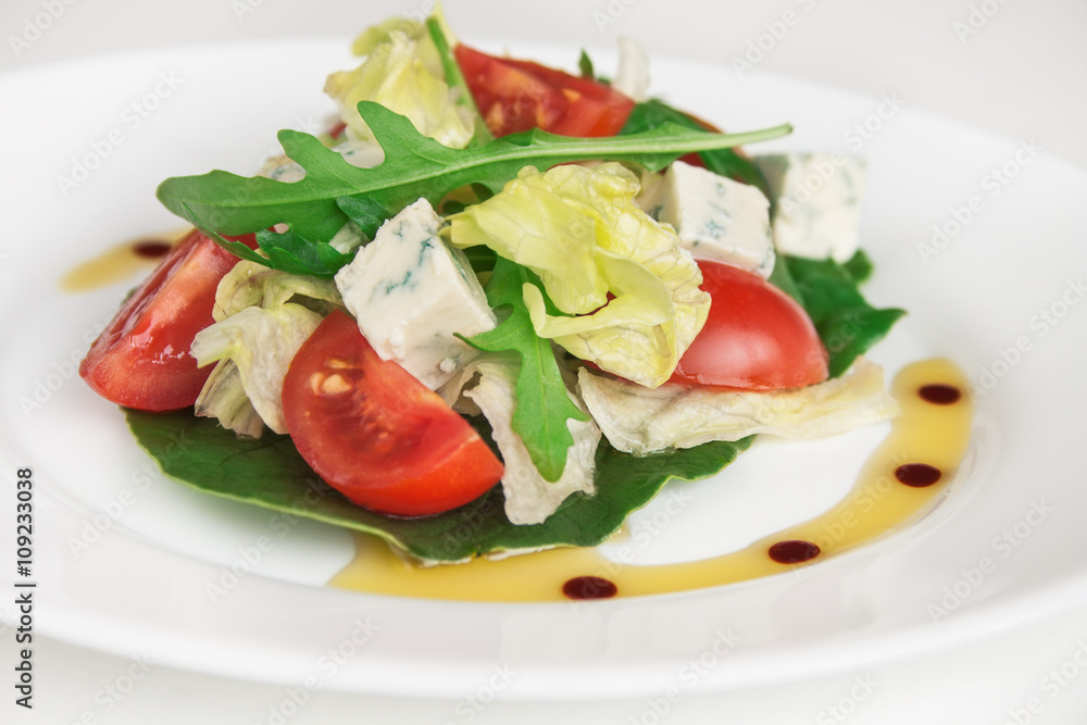 Fresh salad with spinach, cherry tomatoes, arugula and blue cheese. Close up image. Fresh salad with spinach, cherry tomatoes, arugula and blue cheese. Close up image.