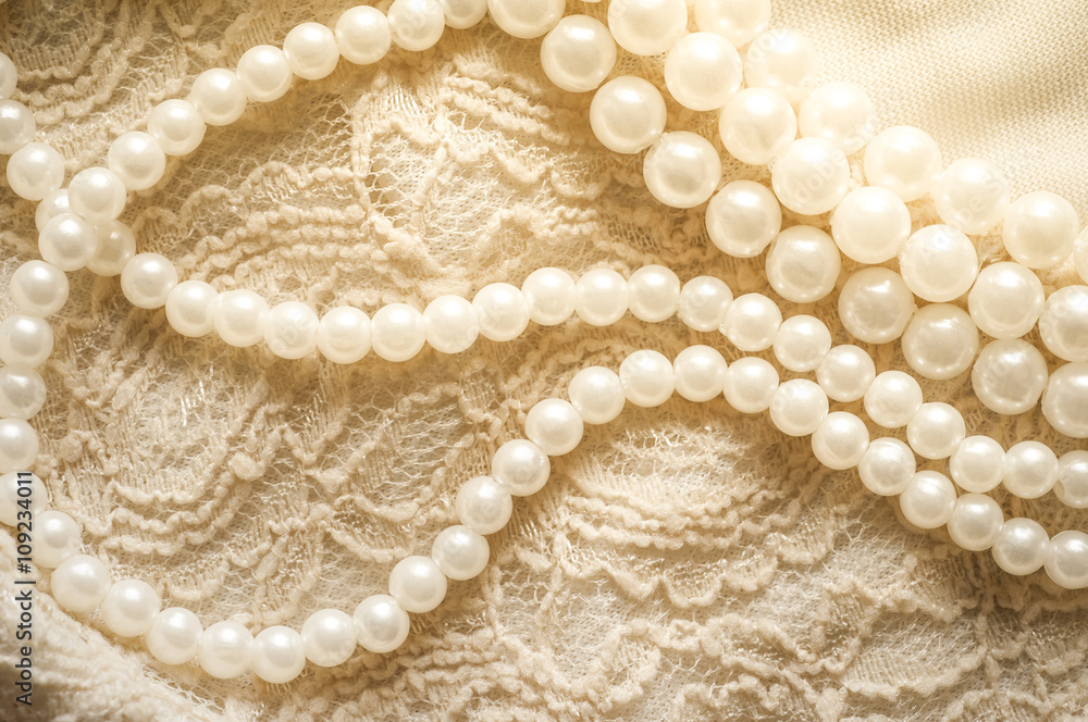 Pearl necklace on lace clothes
