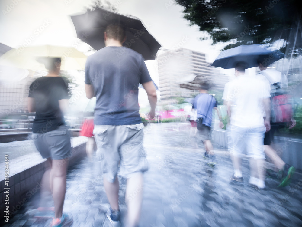People walking in the street on a rainy day.