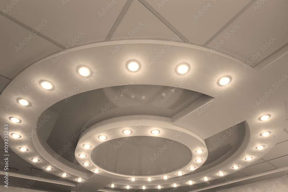 Layered ceiling with embedded lights and stretched ceiling inlay Stock ...
