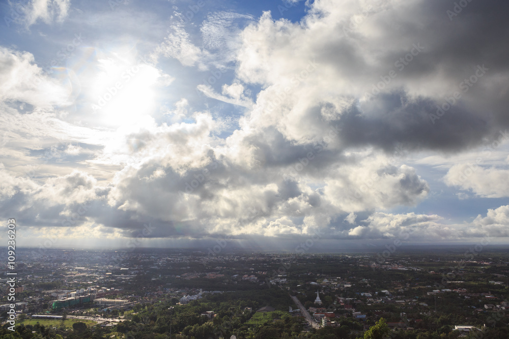 aerial top view of urban city with clouds and sun light reflect