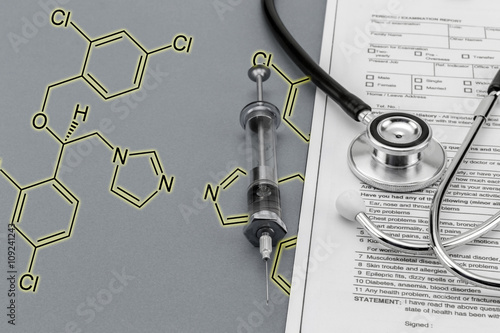 Test medication and stethoscope and old Syringe, Chemical formul photo