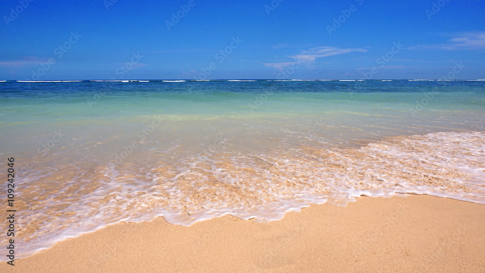 Pendawa Beach,Bali,Indonesia,With Waves And Empty Beach Sands.Travel and spa concept photo. Pendawa Beach,Bali,Indonesia,With Waves And Empty Beach Sands.Travel and spa concept photo.