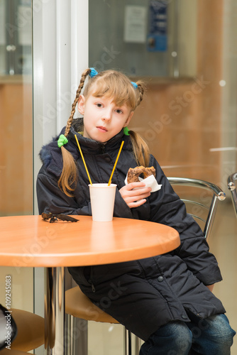 little girl in the cafe photo