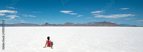 Woman sitting at Bonneville Salt Flat, Utah photo