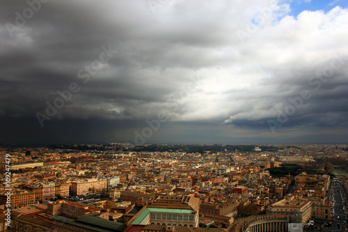 view of Rome from the dome of St Peter's Basilica during a thund