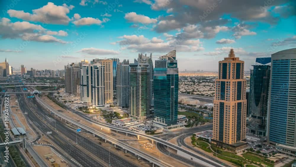 Aerial view of Dubai marina skyscrapers and Jumeirah lakes towers timelapse with traffic on sheikh zayed road. Aerial view of Dubai marina skyscrapers and Jumeirah lakes towers timelapse with traffic on sheikh zayed road.