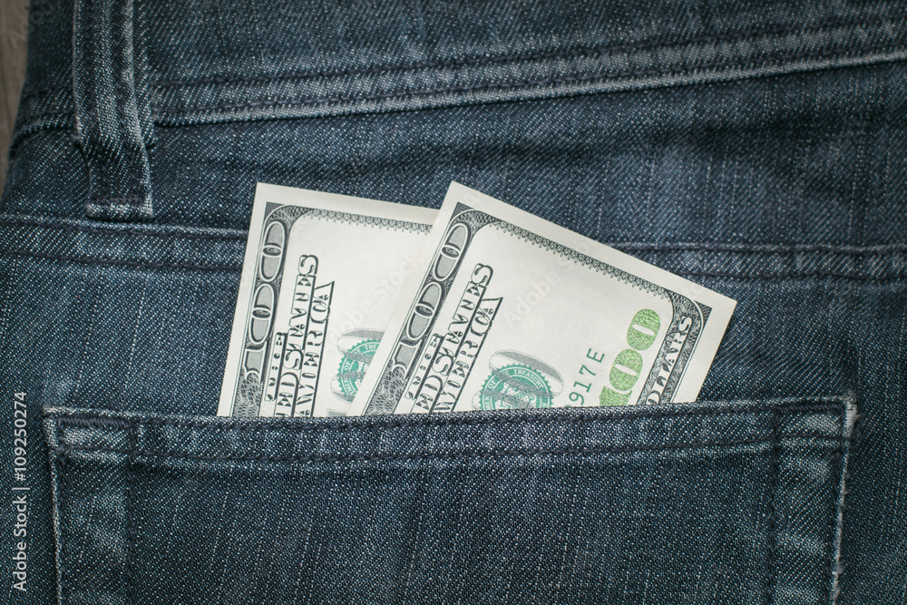 American Dollars in the Pocket of the Jeans. Сloseup. American Dollars in the Pocket of the Jeans. Сloseup.