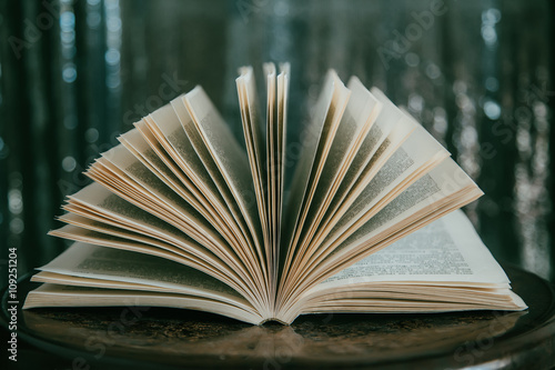 Open book  with bokeh effect in the background